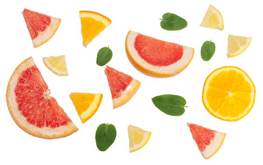 Wall Mural - Sliced pieces of citrus fruits isolated on white, top view