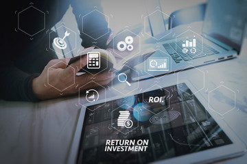 Poster - Businessman hand holding book and digital tablet.Photo finance manager working new Investment project office.Using new technology device.Graphic icons.Strategy business stock exchanges