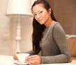 © Raisa Kanareva - female holding a mug of coffee
