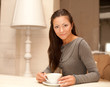 © Raisa Kanareva - female holding a mug of coffee