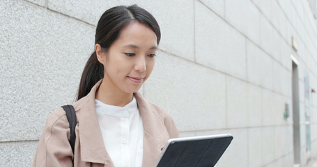 Poster - Business woman work on tablet computer at outdoor