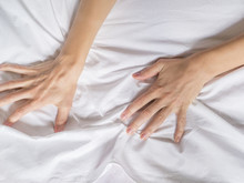 Hands Of Women Pulling White Sheets In Lust And Orgasm