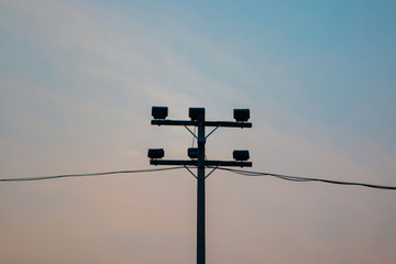 Silhouette electricity lamp post spotlight