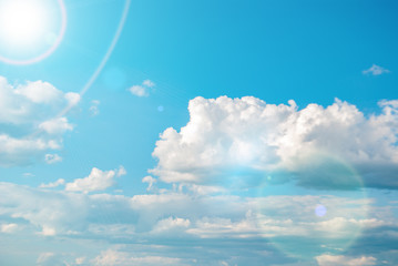 blue sky white clouds and bright sun