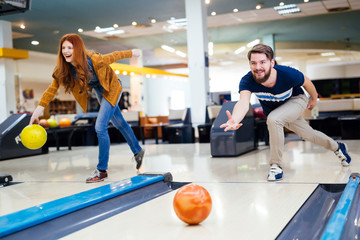 Wall Mural - Friends enjoying bowling at club