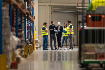 Wall Mural - Workers with supervisors at warehouse