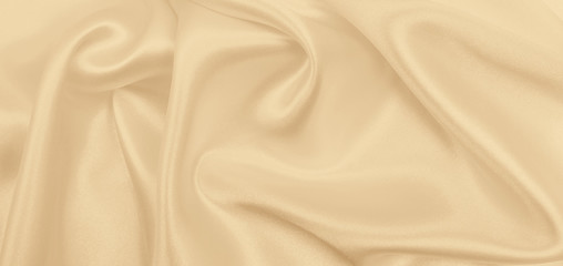 smooth elegant golden silk or satin luxury cloth texture as wedding background. luxurious background