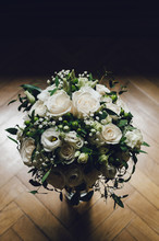 White Roses Bouquet On A Glass Jar