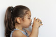 © kaganskaya115 - Cute little girl holding glass of water. and Child drinking water.