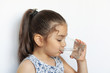 © kaganskaya115 - Cute little girl holding glass of water. and Child drinking water.