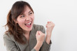 happy excited girl looking and pointing; portrait of excited, surprised woman pointing her hand to something; woman looking at blank space for important point content; asian chinese woman adult model