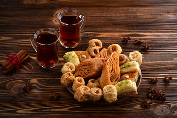 Turkish sweet baklava on plate with Turkish tea.