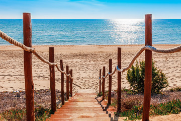 Wall Mural - Panoramic sea beach landscape near Gaeta, Lazio, Italy. Nice sand beach and clear blue water. Famous tourist destination in Riviera de Ulisse. Bright sunny light and sunset.