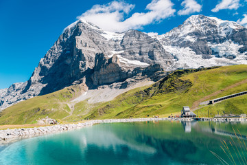 Fallbodensee lake and snowy mountain at Jungfrau region in Switzerland