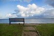 Wooden bench on open space overlooking a beautiful sea view