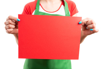 Wall Mural -  Close-up of female retail sales worker hands holding empty paper.