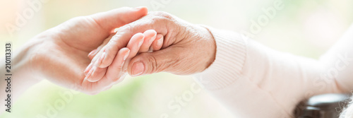 Fotografía Close-up of tender gesture between two generations