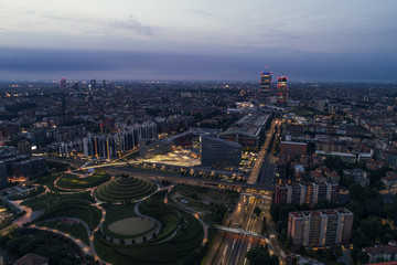 Canvas Print - Milan (Italy) landscape at night with new skyscrapers of the district named CityLife, aerial view.