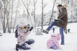© AnnaDemy - Happy loving caucasian family of mother father and daughter play, having fun in winter snowy park. Cute little girl playing