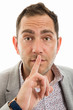 © Catalin Pop - Close-up portrait of business man making silence gesture
