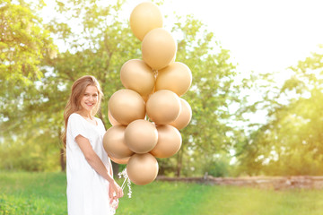 Sticker - Beautiful young woman with balloons outdoors