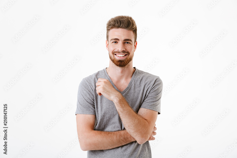 Handsome young man standing isolated smiling - obrazy, fototapety, plakaty 