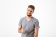 © Drobot Dean - Happy young man make thumbs up gesture.