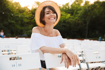 Happy young girl in summer hat