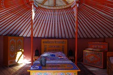 View Of Inside A Yurt, Traditional Nomad Housing In Asia And Mainly Mongolia. Colored And Tiny Furniture.