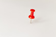 © Vladimir - Red pushpin on white background