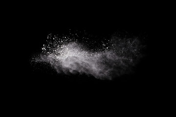 Wall Mural - launched white powder, isolated on black background.