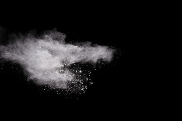 Wall Mural - launched white powder, isolated on black background.