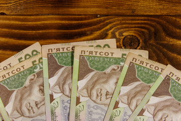 Ukrainian currency. Five hundred hryvnia banknotes on wooden desk