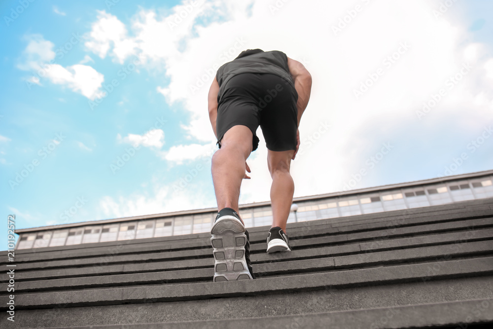 Sporty young man training outdoors