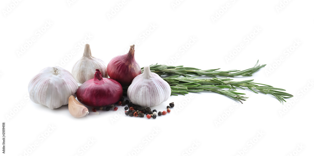 Fresh onions, garlic and spices on white background