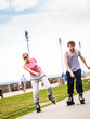 © anetlanda - Two people race together riding rollerblades.