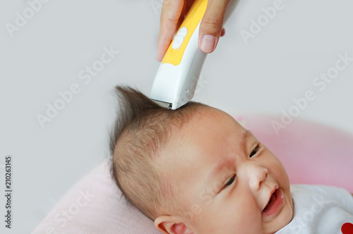 Closeup Asian Infant Baby Boy Getting A Haircut Buy This Stock