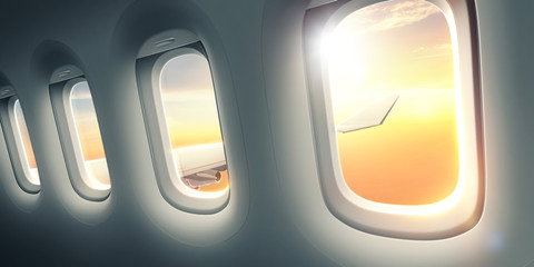 Wall Mural - beautiful sunrise through the airplane window