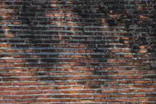 Antique Ancient Old Dirty Red Brick Wall On The Urban Street. Old Dirty Red Brick Wall Pattern Background.