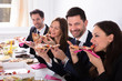 © Andrey Popov - Businesspeople Enjoying Slice Of Pizza