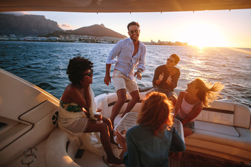 Wall Mural - Group of young people dancing in boat party