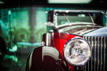 Close-up Of Headlights Of Red Vintage Car. Exhibition