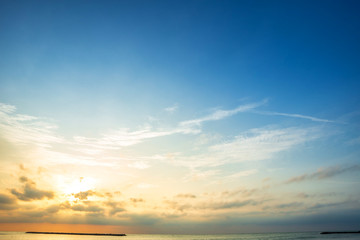 Wall Mural - beautiful early morning sunrise over the sea the horizon,blue sky background texture with white clou