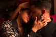 © Manuel Ruiz Martinez/ADDICTIVE STOCK - Embracing happy black couple on couch