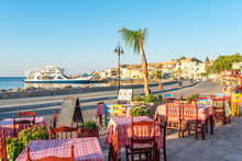 Tavernas, Shops And Stores At The Seaside Promenade Of The Small Town. Tourism Is A Main Factor Of Economy In Town