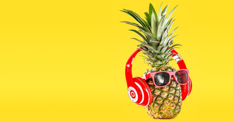 Summer photo of pineapple and yellow background of free space for your text. 