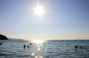 Wall Mural - sunset over the sea, beach, Beach full sun, the sun and the sea, Paddle Boarding the afternoon away. A great way to stay fit and healthy with this exciting new sport.