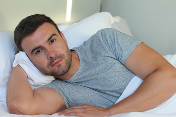 Comfortable man waiting for you in bed 