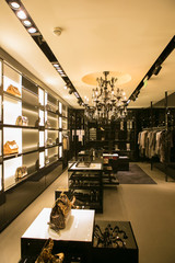 bright and fashionable interior of shoe store in modern mall