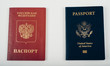 © Evgenia Parajanian - Red Passport of Russia (Russian Federation) - Cyrillic labels and Blue passpost of USA (United states of America) on white background.